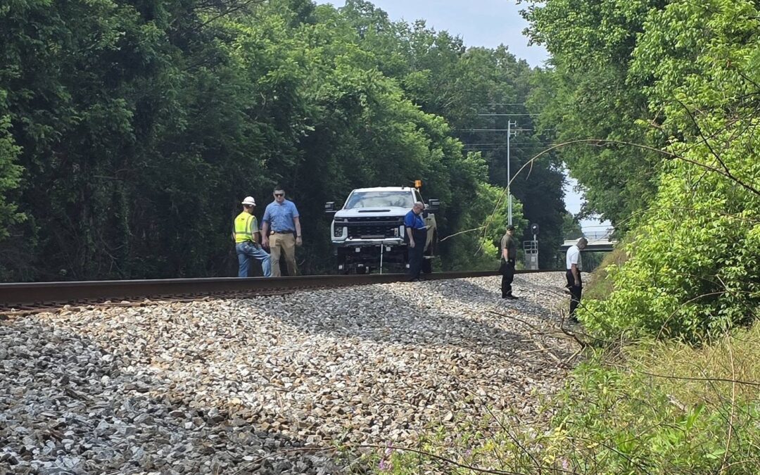 Officers on railroad tracks